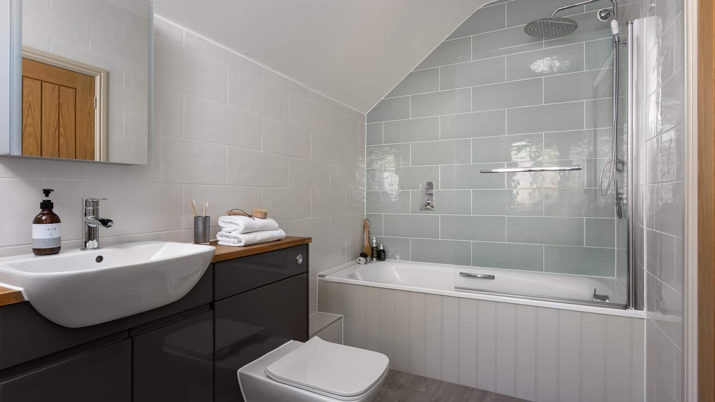 A delightful ensuite lies next door