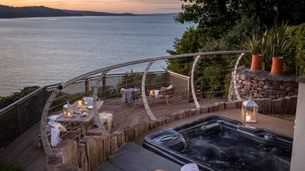 Admire glittering sea vistas from the alfresco hot tub...