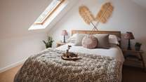 Nestled in the eaves of the cottage is the darling second bedroom