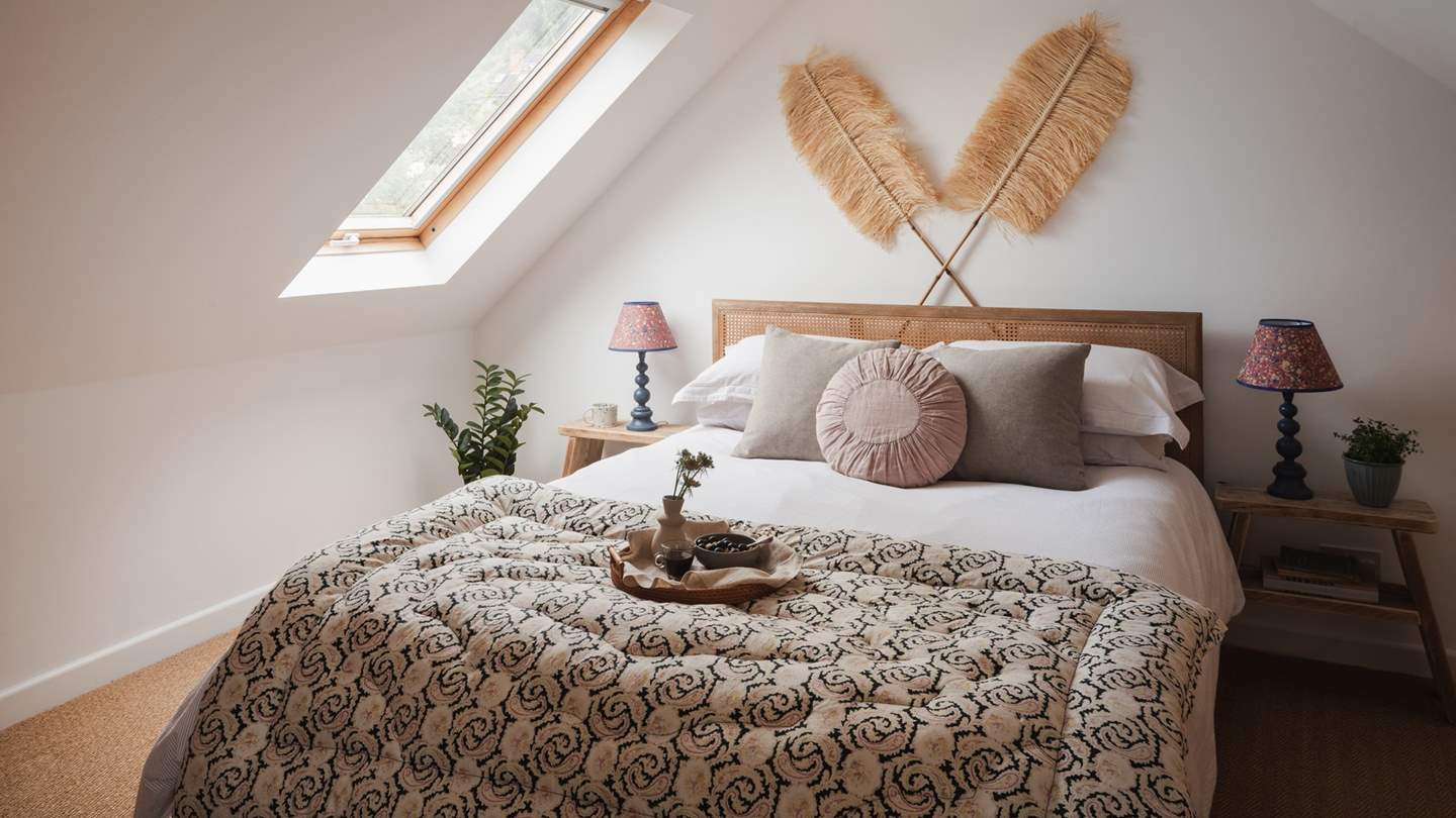 Nestled in the eaves of the cottage is the darling second bedroom