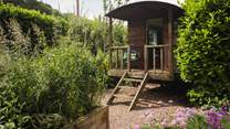 Wander the stone path to discover the lovely addition of a shepherds hut