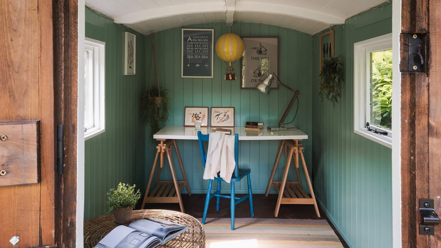 Here you’ll find a Scandi-style desk with chair and bean bag chairs, along with the rare and luxurious addition of air conditioning