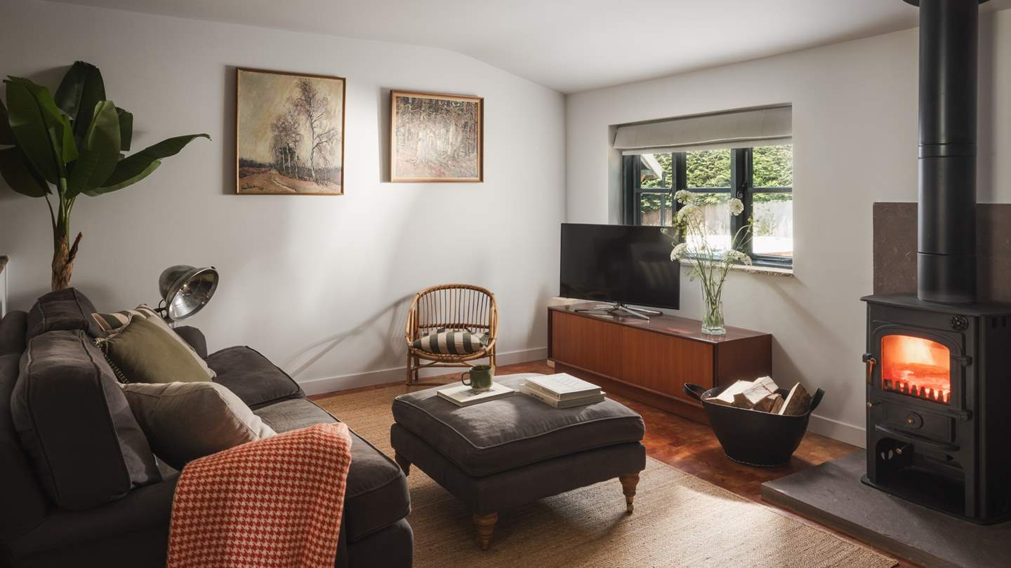 Evoking a retro feel, the kitchen and dining space promises a classic mid-century aesthetic