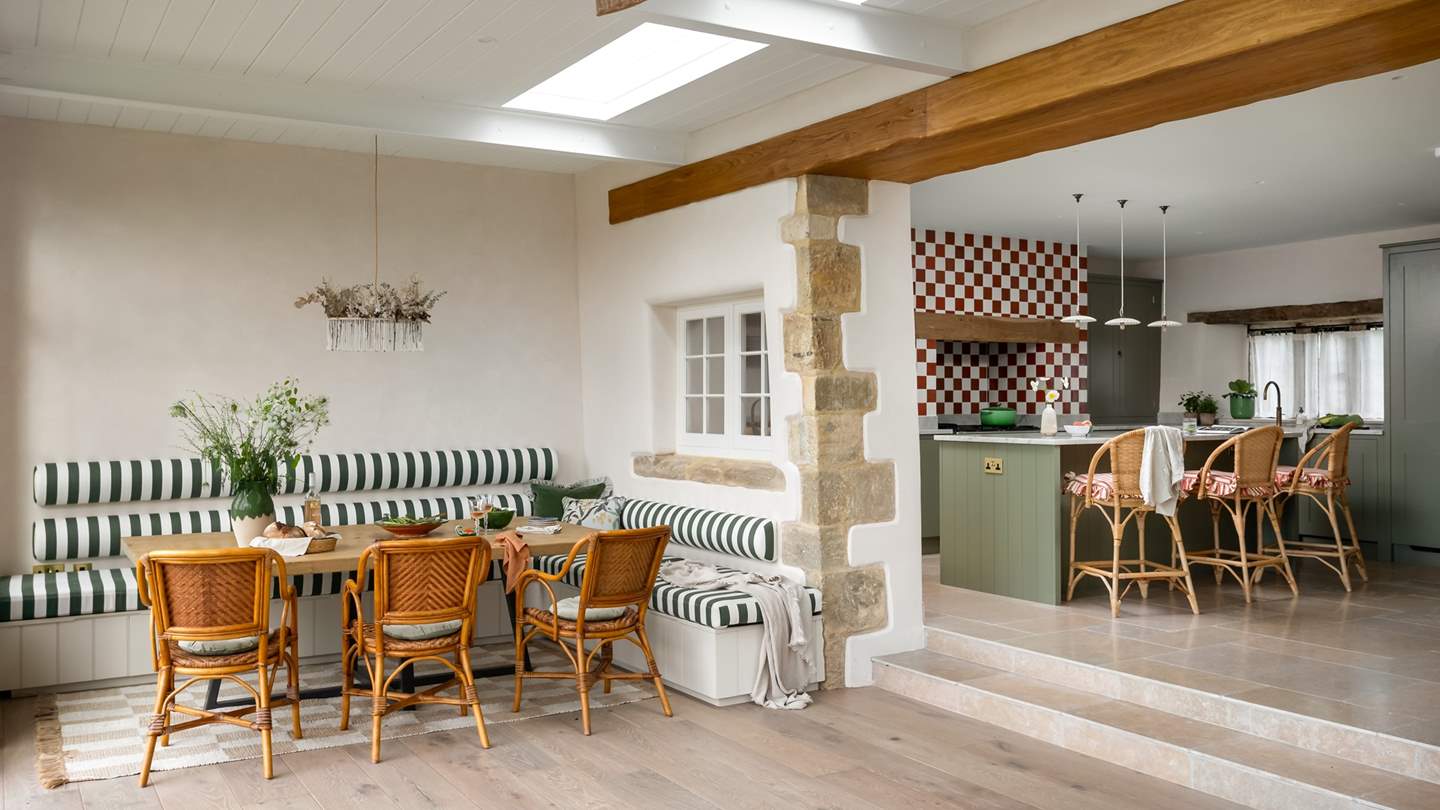 Up a small set of steps is the cheerful, vintage-style kitchen...