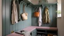Towards the rear of the retreat is the spacious boot room, with bespoke carpentry storage for coats and jackets