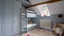 Discover the nautical-inspired bunk room...