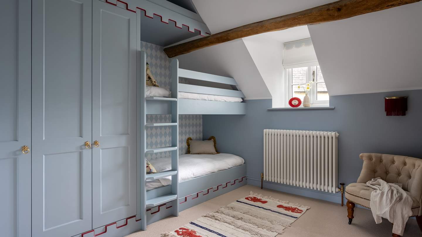 Discover the nautical-inspired bunk room...