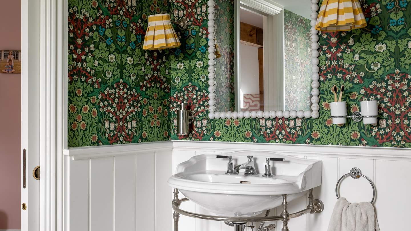 We adore the flamboyant, jungle-inspired wallpaper