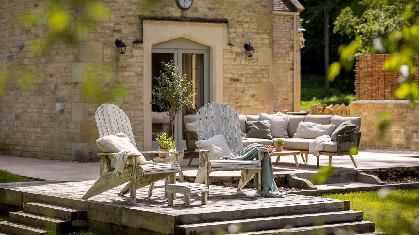 Through the French doors await the 1.5 acre garden space with a lawn and patio