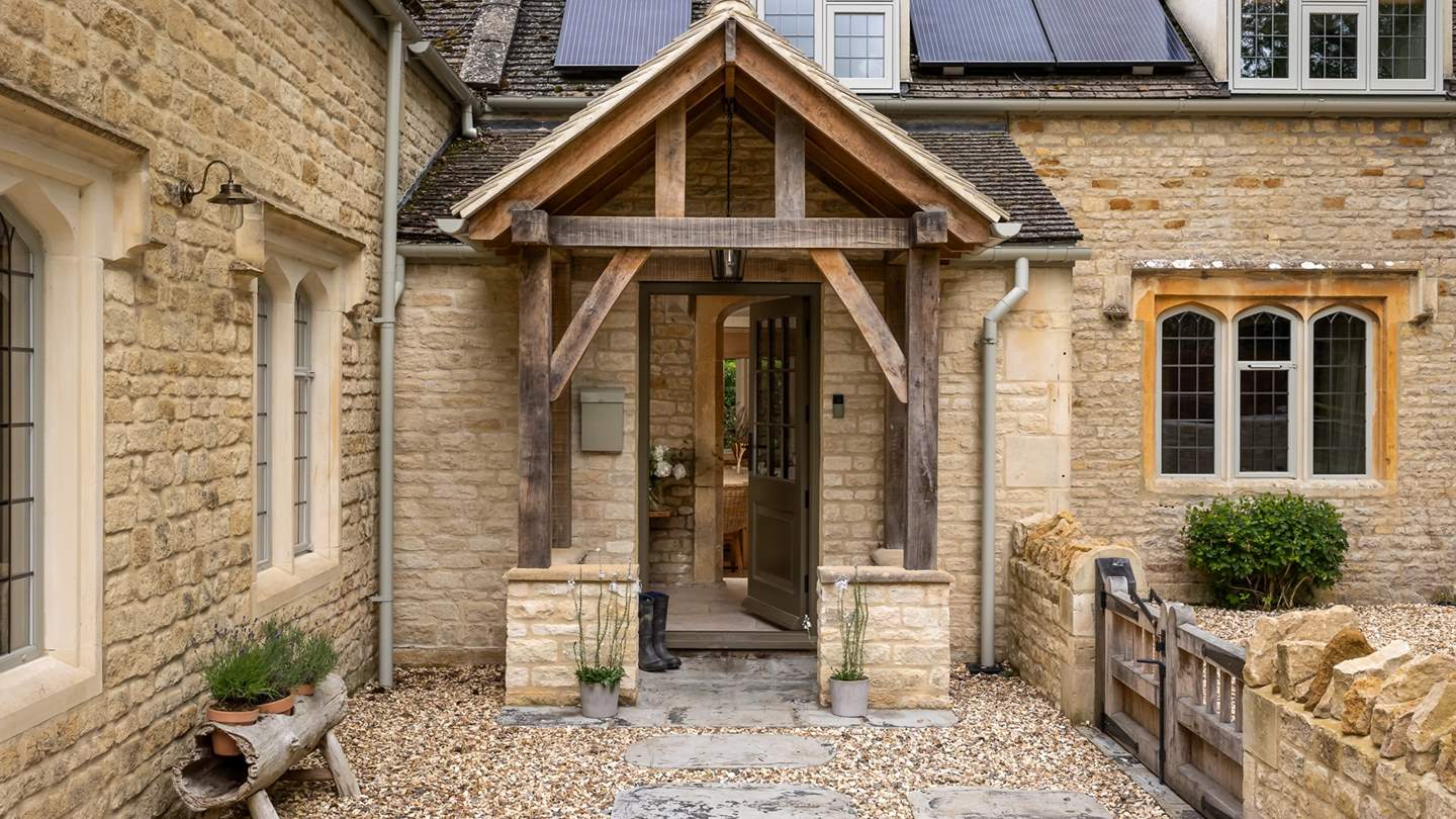 Staycation magic awaits through the rustic timber-framed entrance...