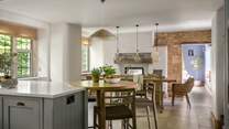 Culinary artists will adore creating dishes in the country chic kitchen