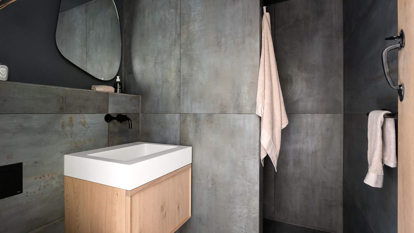 You'll find a separate, shower with a rainfall head next to the boot room on the ground floor