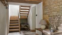 Take the wooden staircase to find Amoretta's stunning bedroom spaces...