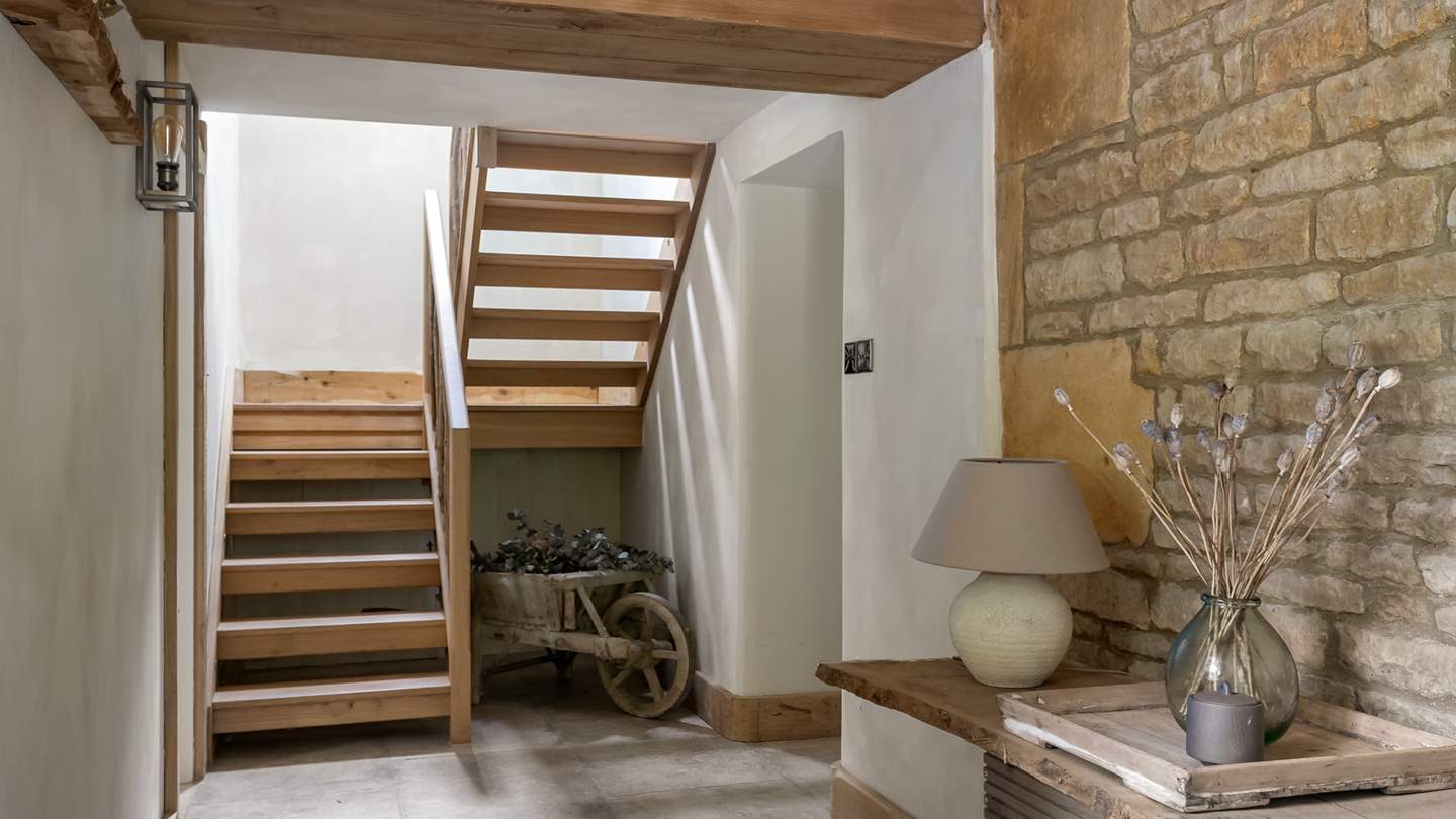 Take the wooden staircase to find Amoretta's stunning bedroom spaces...