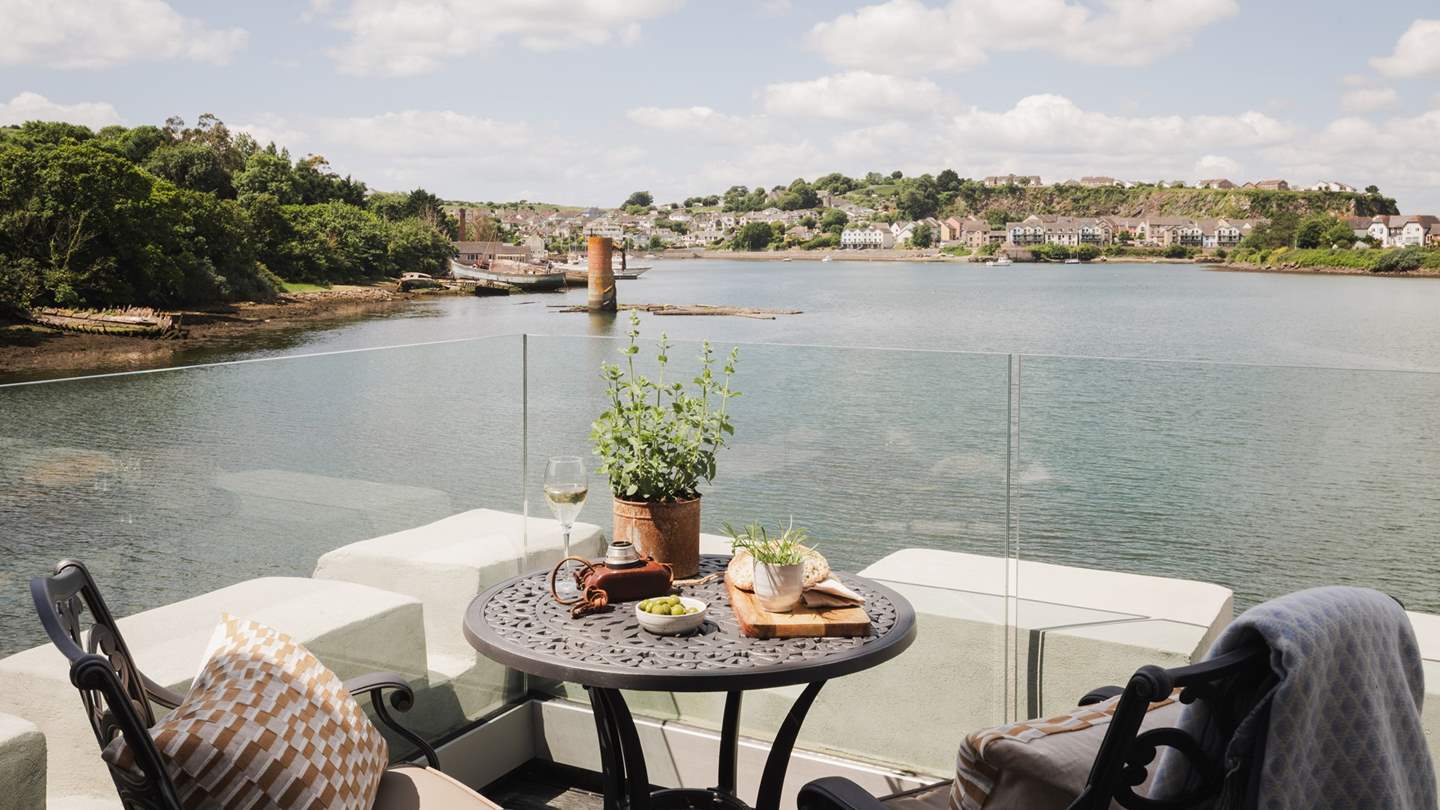 With access to a suntrap terrace, this is a truly tranquil spot to gaze over boats on the water beyond