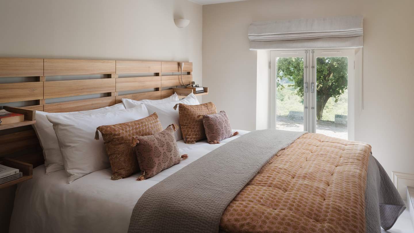 The second bedroom is located on the ground floor and enjoys patio doors to the front terrace
