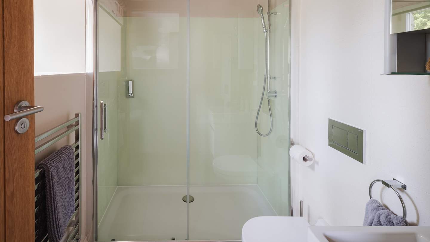 For comfort and privacy, it also benefits from an ensuite bathroom with a walk-in shower