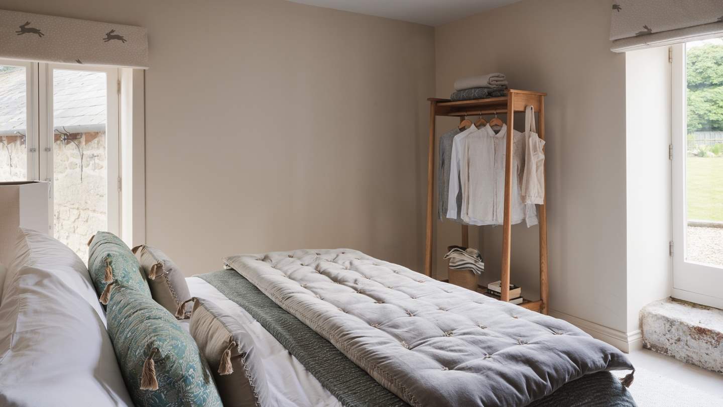 This bedroom offers an ensuite with a walk-in shower for added comfort and convenience