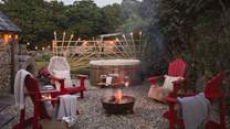 The outdoor terrace, illuminated by a crackling fire pit, ensures each moment is simply a dream