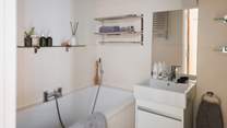 Offering additional comfort an en-suite bathroom with a bath and separate shower