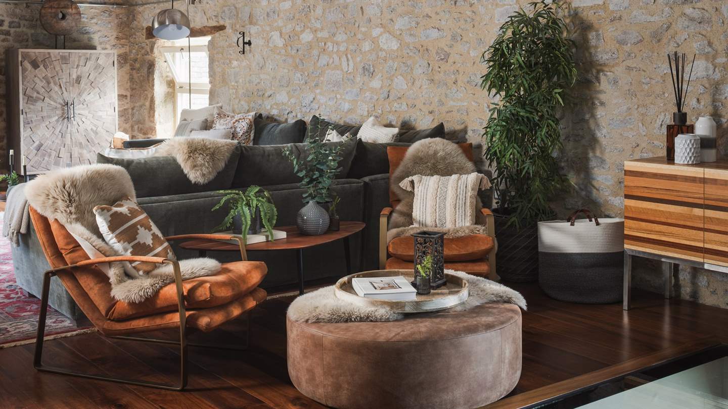 Settle into the sumptuous L-shaped sofa or fireside chairs to recline with a book