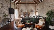 A breathtaking space framed by vaulted ceilings and ribs of exposed wooden beams