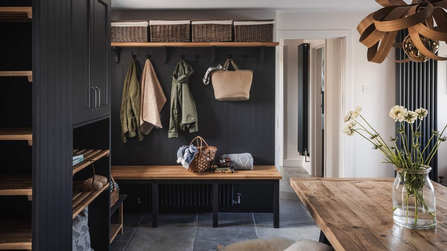 Step inside to be greeted by the welcoming entrance hall of Halcyon, built in 1850, where an elegant boot room with bespoke joinery awaits