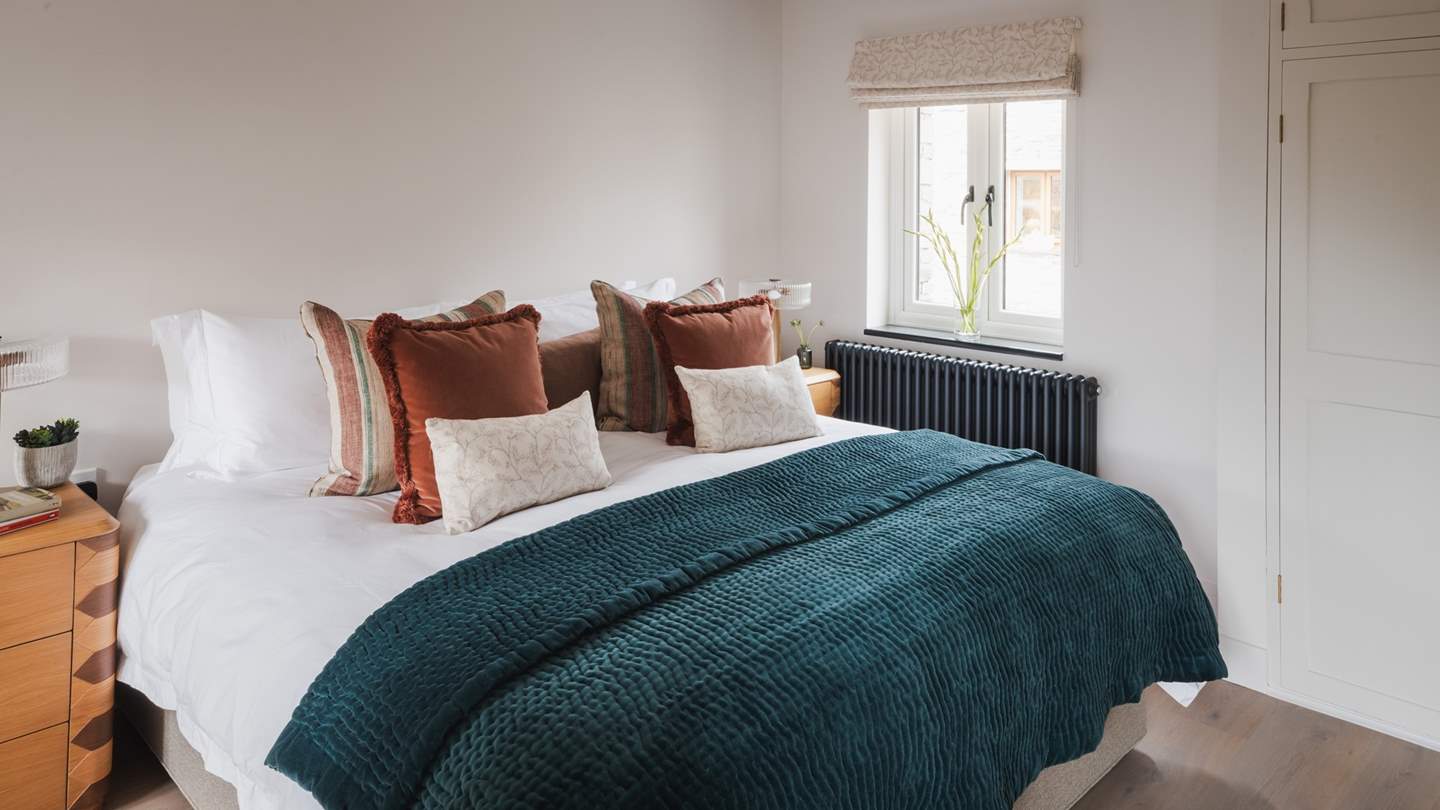 Draped in the highest quality sheets and topped with cushions and throws, promising cosy relaxation