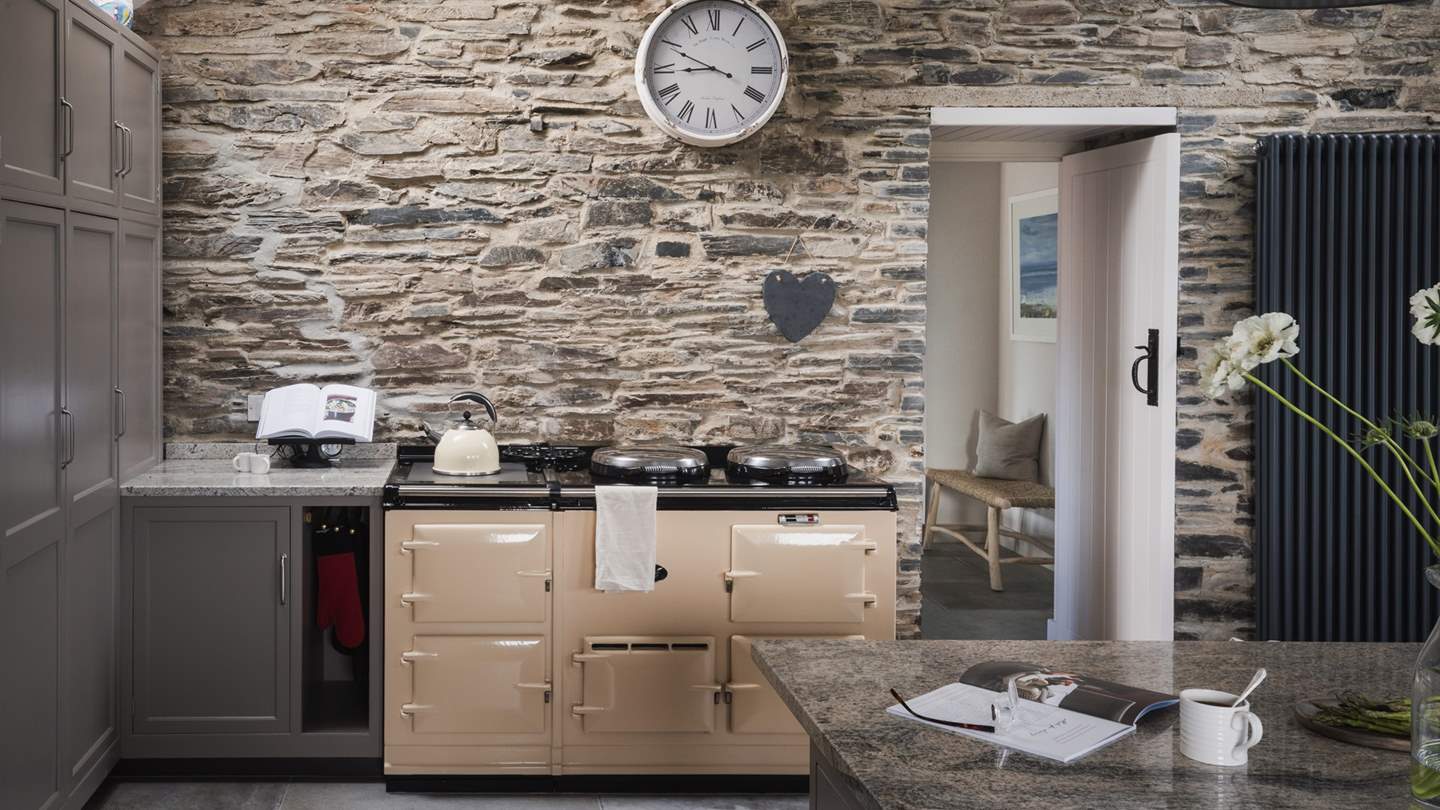 Exposed stone walls beautifully harmonise heritage features and rich details