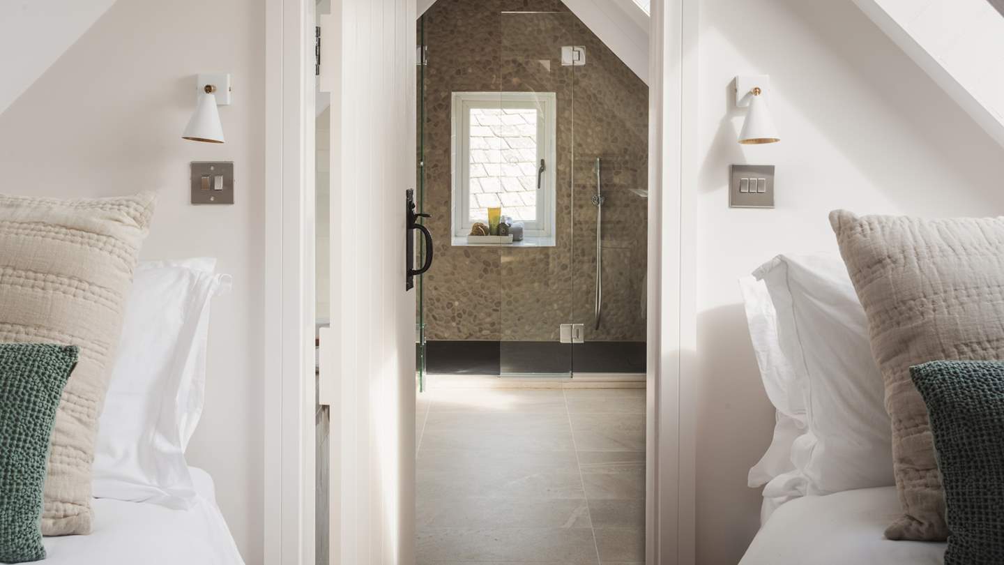 Set within the eaves, it has winsome, sloping ceilings and is home to two single beds enveloped in the finest six hundred thread count cotton sheets