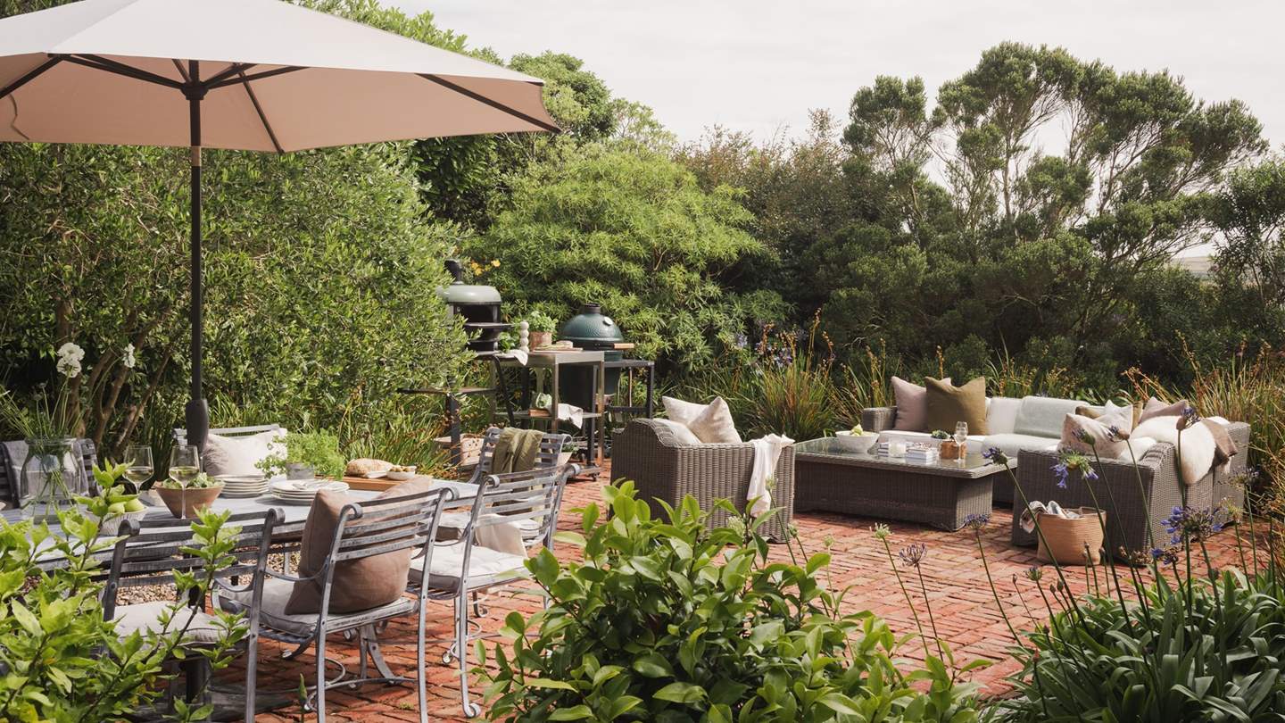 Embraced by tropical foliage, the outdoor space at Halcyon entices with Mediterranean gardens and dining areas