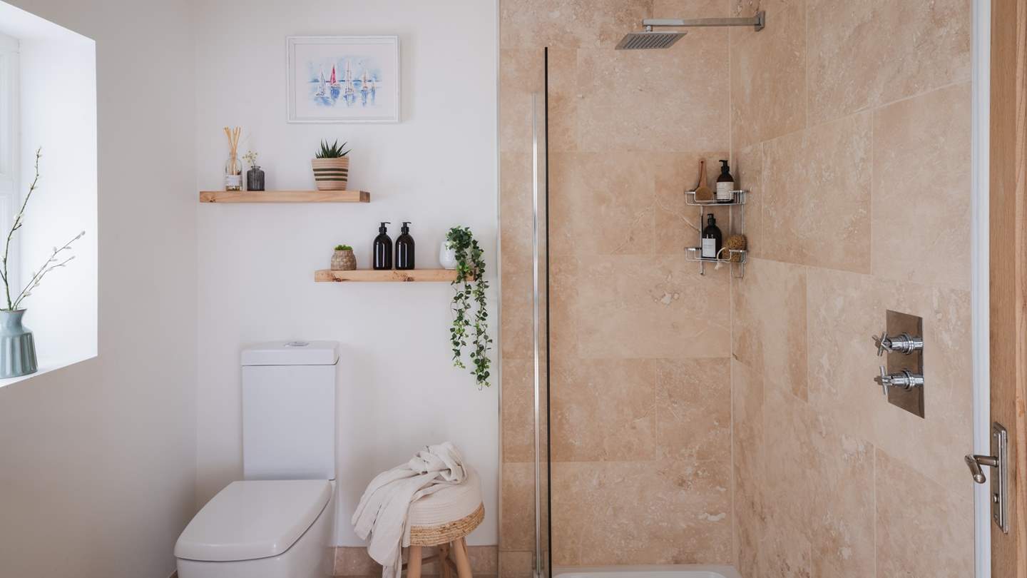 This space benefits from a lovely ensuite bathroom with a walk-in shower