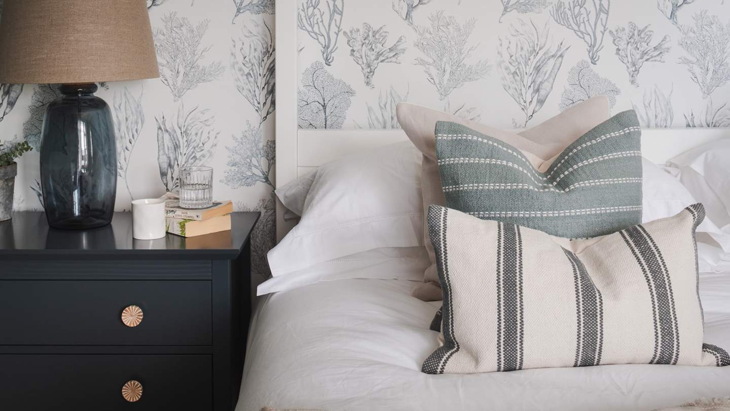 Earthy tones and XV Stripe Kelp Forest wallpaper take inspiration from the stunning shorelines of the Isle of Wight and radiate coastal luxe