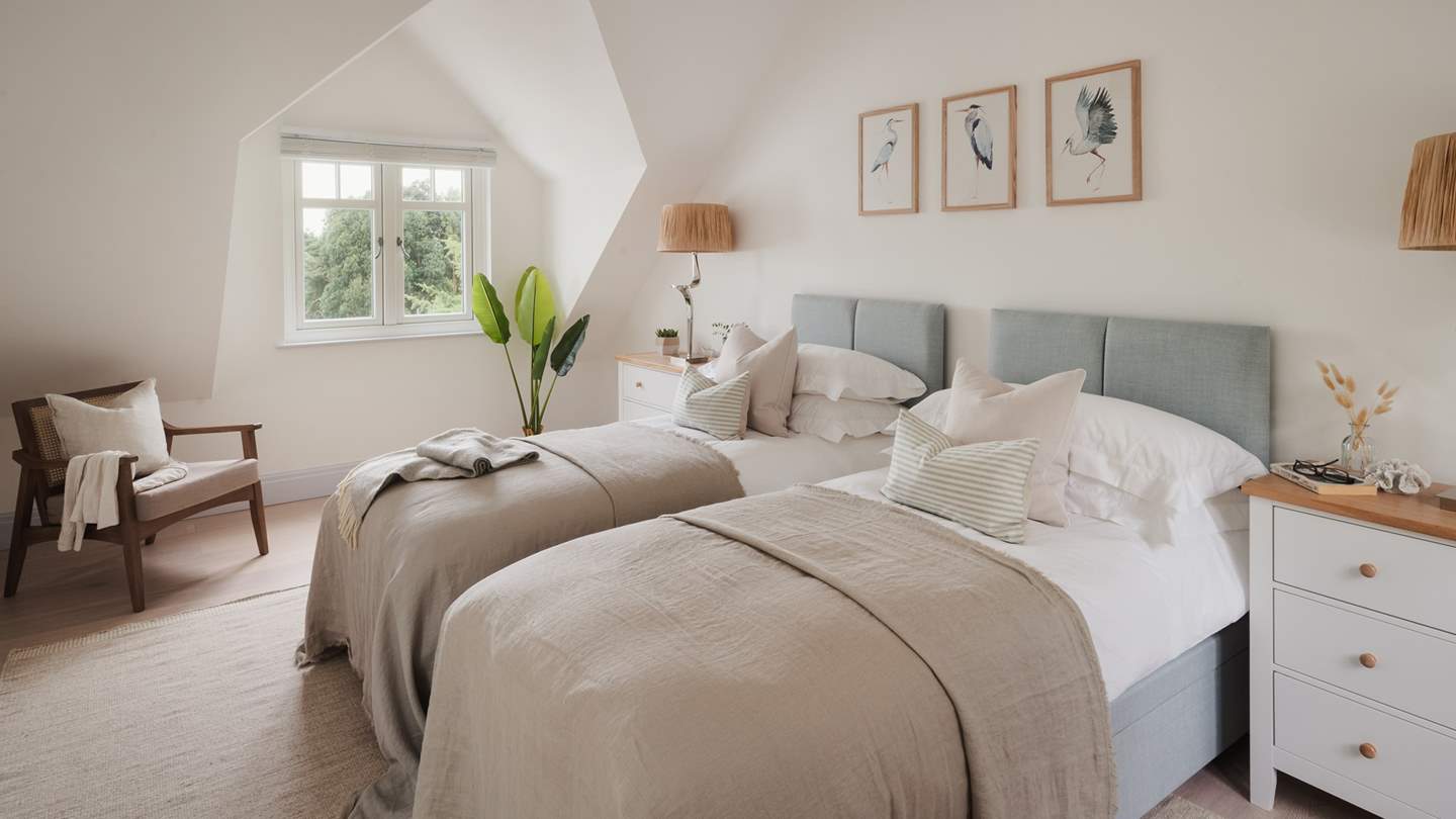 Marisol’s fourth bedroom is another space ideally suited to friends or children with a sage-hued super king that can be converted into twin beds as required