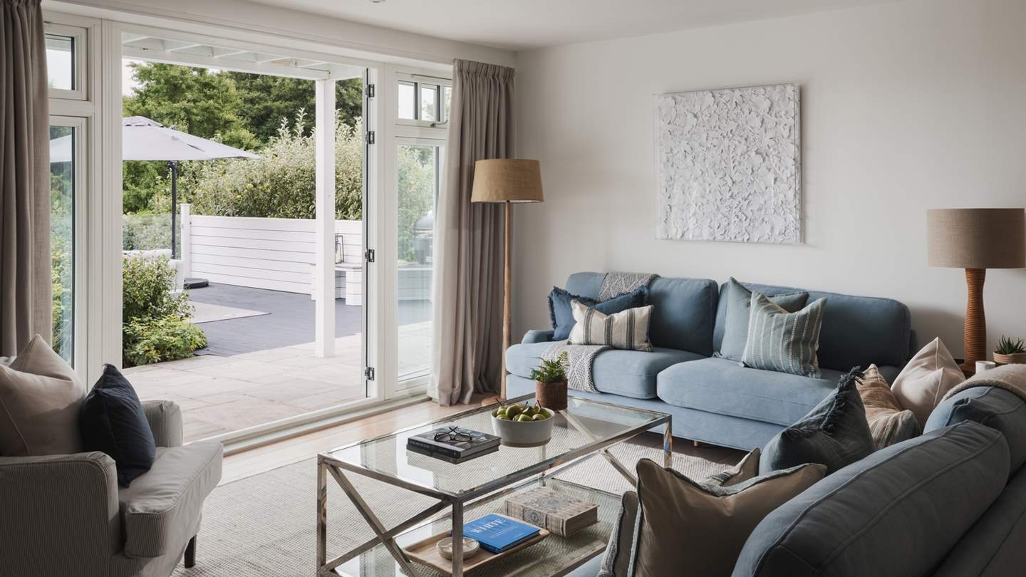 Uncover a beautiful open-plan living area made for gathering in style, leading out onto the sea-view terrace
