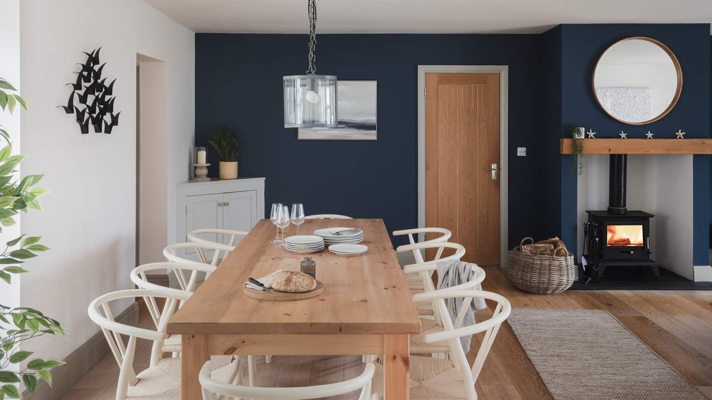 A beautiful farmhouse-style table of solid oak with seating for up to ten offers plenty of room for feasting
