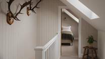 Along the wood-panelled corridor you'll find the second twin bedroom