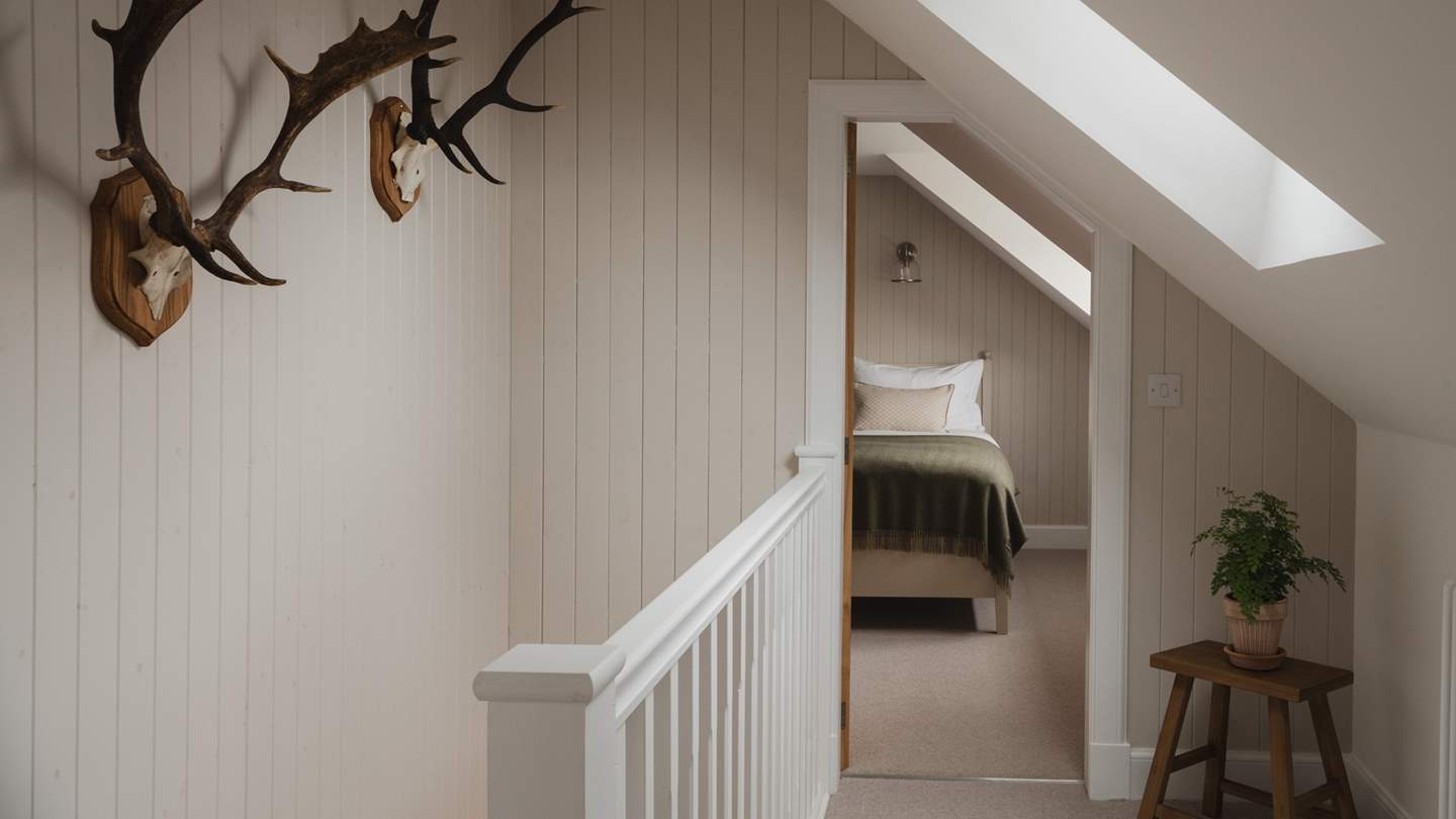 Along the wood-panelled corridor you'll find the second twin bedroom