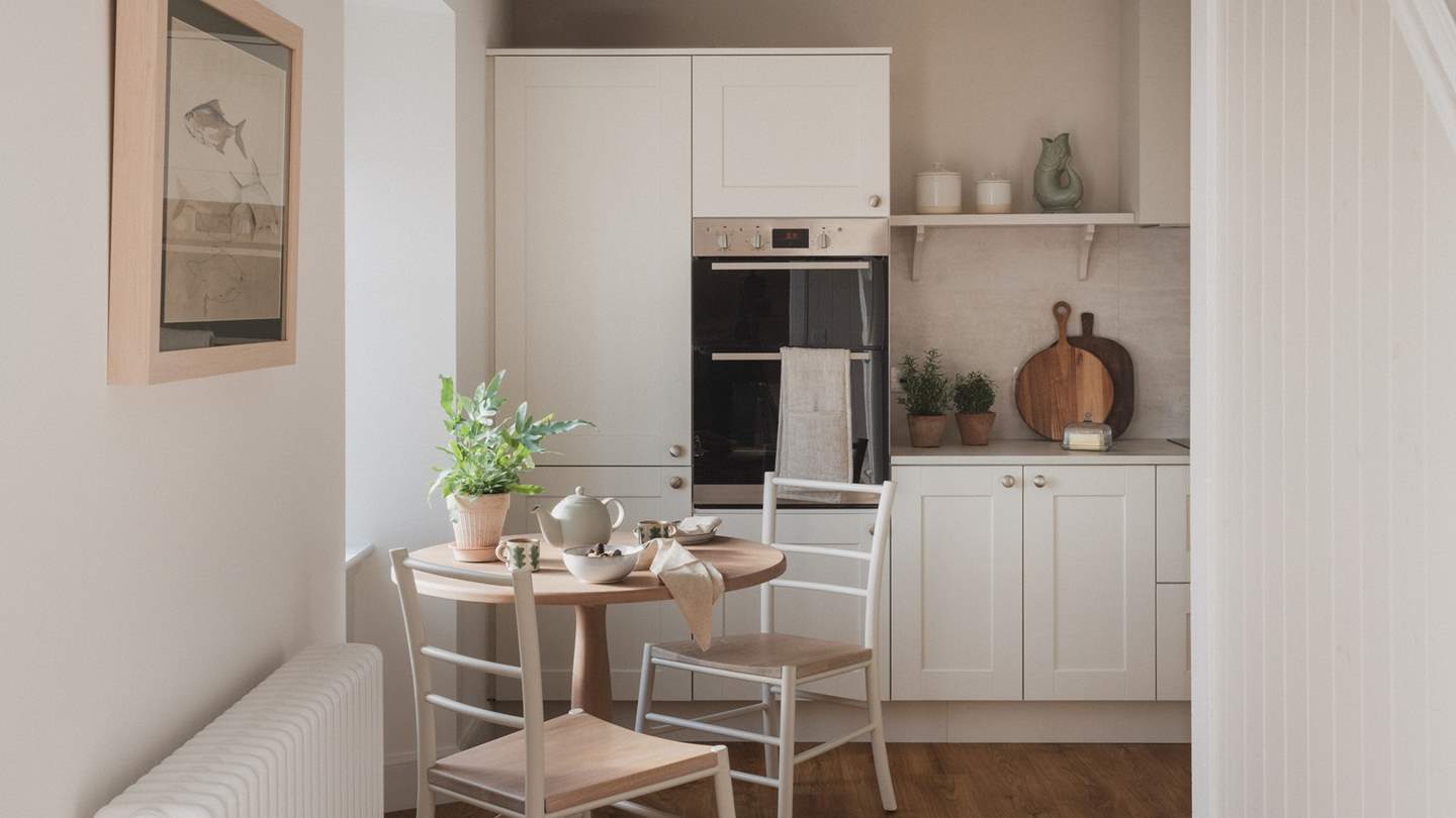 Designed in a shaker-style, you'll find an array of kitchen essentials hidden within the cabinetry