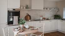 Savour mealtimes with your nearest and dearest in the bright and welcoming kitchen and dining space