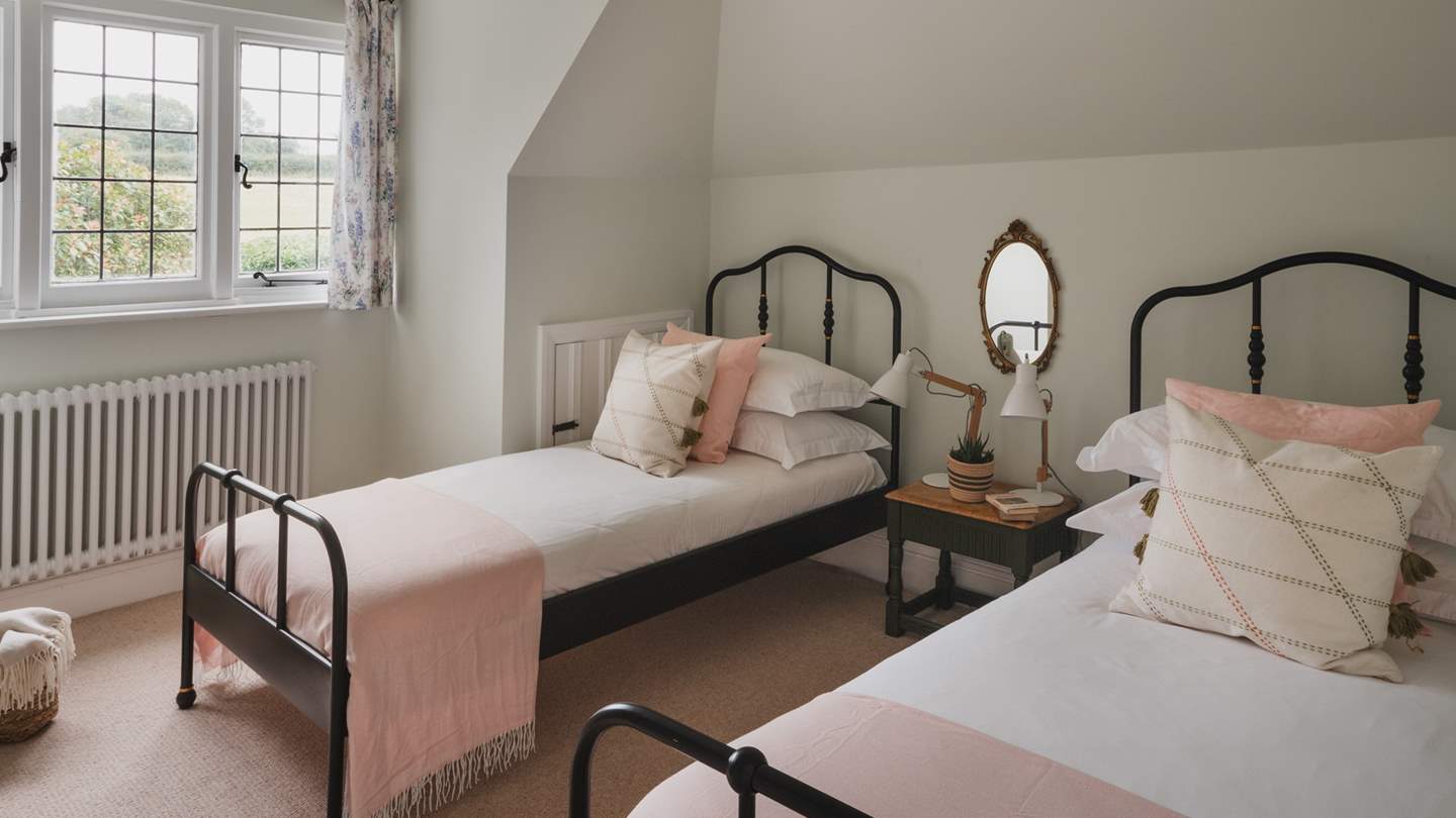 Promising verdant vistas, the fifth bedroom is oh-so-sweet