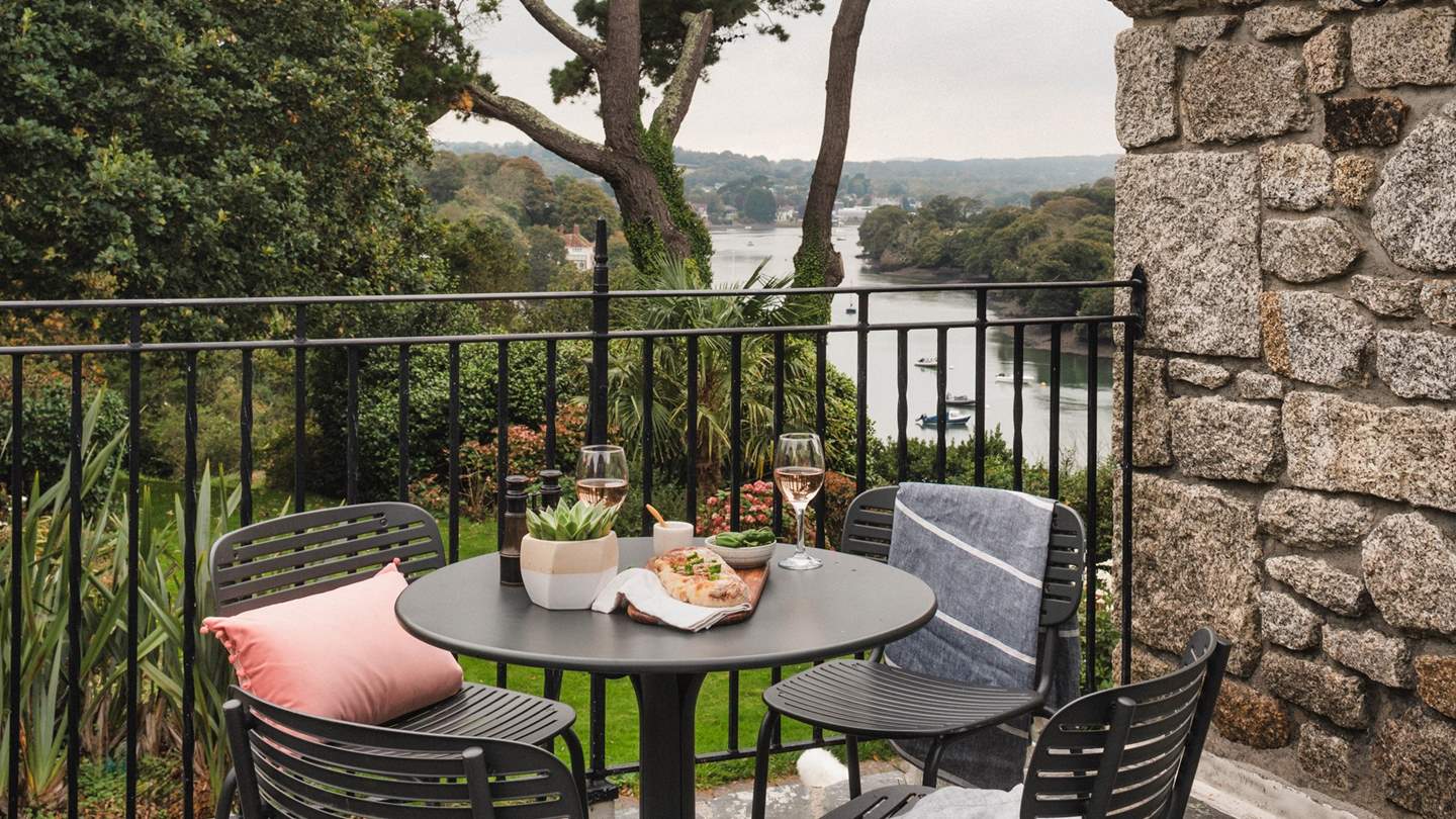 Patio doors open from both the kitchen and the dining room onto the terrace, welcoming balmy sea breezes on warmer days