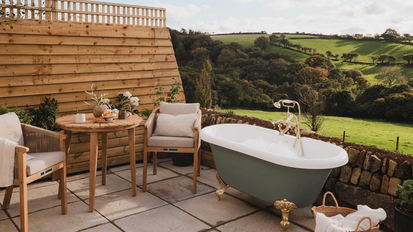 For alfresco brunches and sun-kissed soirees, uncover an outdoor table and chairs, hugged by two cushion-topped seats for added comfort 