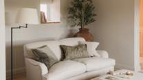 Settle into an agenda of blissful relaxation from the natural Cotswolds Company sofa 