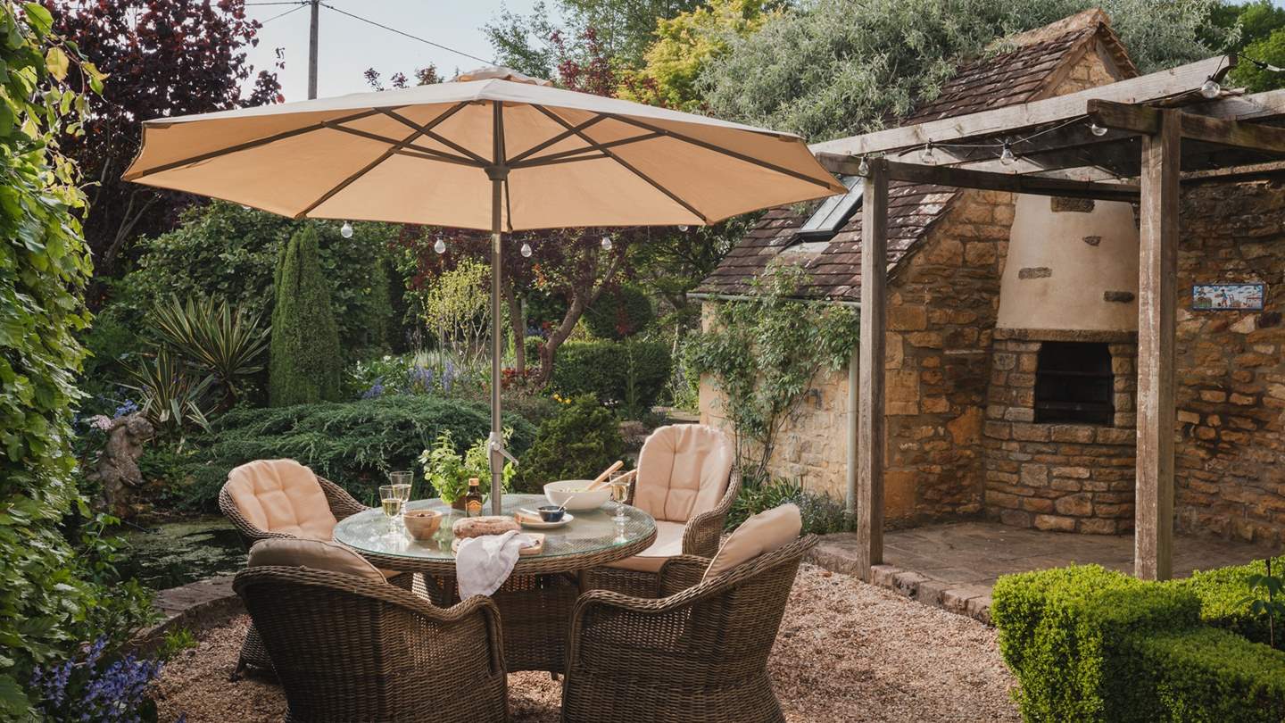 Alfresco magic resides beneath the shade of the pretty parasol