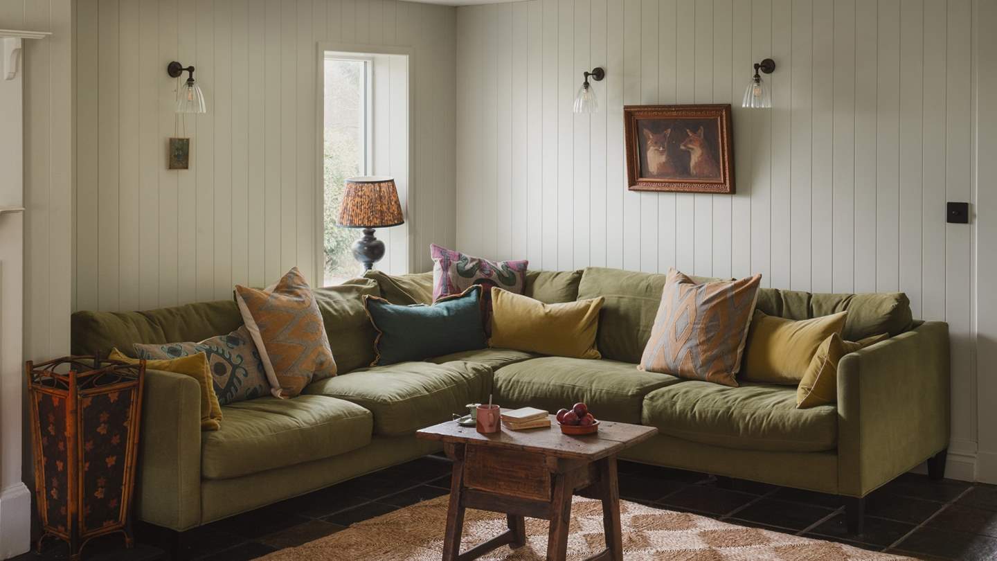 Stretch out in style on the olive L-shaped sofa