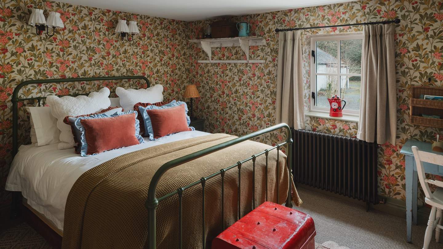A celebration of colour, the eclectic second bedroom is a stunning space to unwind