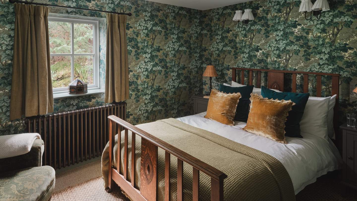 Adorned in Zoffany Richmond Park wallpaper, uncover the master bedroom of dreams