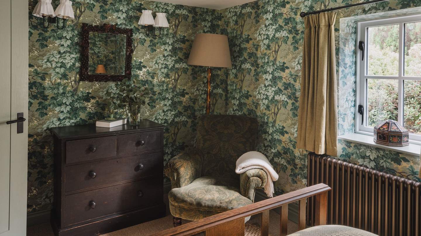 The calming a forest green palette offers a soothing setting in which to slumber