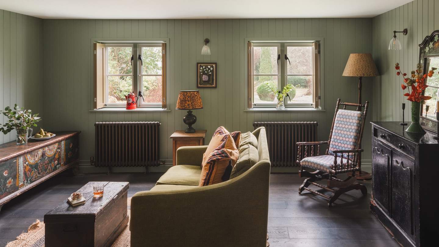 The contemporary and traditional seamlessly blend here, with playful antiques and vibrant oil paintings